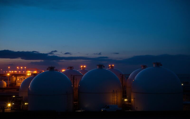 Spherical gas storage tanks at dusk